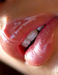 Smoking-hot babe from the Orient bares it all on the couch.