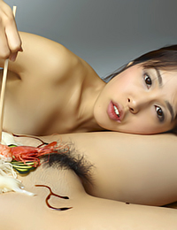 Konata eats sushi off of Lulu's naked body.