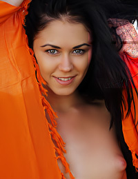 This astonishing brunette models outdoors and strips naked.